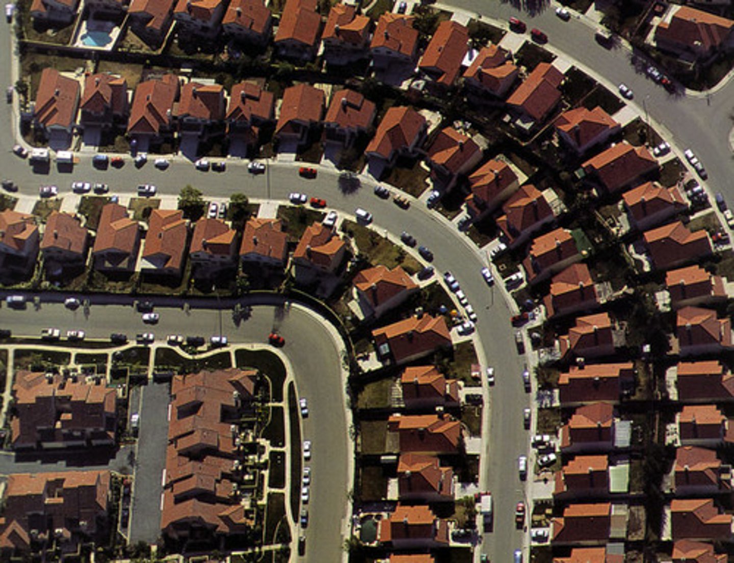<p>rapidly growing city that remains essentially suburban in character even as it reaches populations more typical of a large city</p>