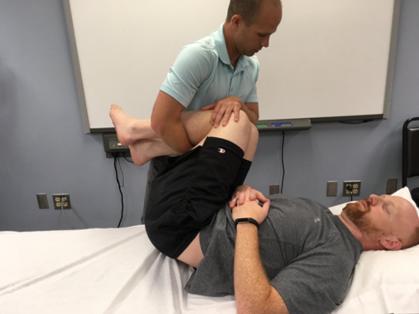 <p>flexion bias</p><p>flex first then rotate patient’s legs as above</p><p>usually move legs towards painful side</p><p>apply overpressure by holding down pt’s trunk / ribcage</p>
