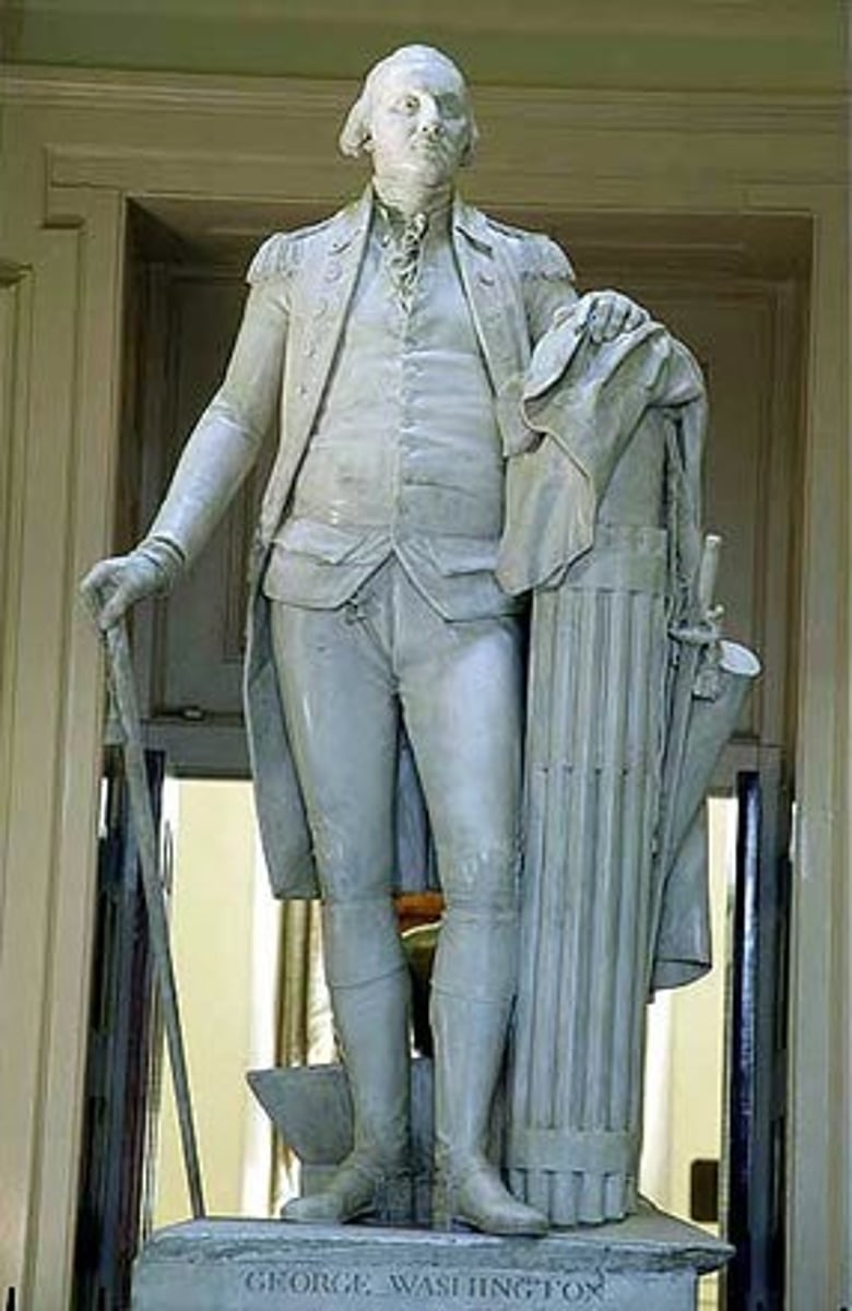 <p>A bundle of sticks around an axe - a symbol of authority (Roman origin) - Virginia State Capitol Washington Statue leans on this</p>