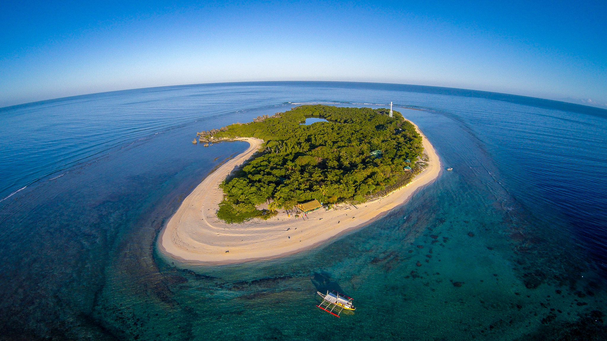 <p><span style="color: #000000">Diving mecca of the Philippines 34 KM reef. Divers can explore the fine white sand bottom with its colorful array of approximately 400-500 coral species. Almost 500 marine species, including a variety of sharks, stingrays and manta rays, can also be spotted around the area</span></p>