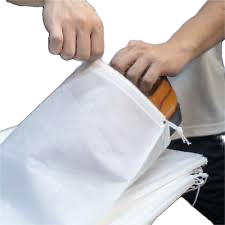 <p>to place items into a bag for carrying or selling. </p><p></p>