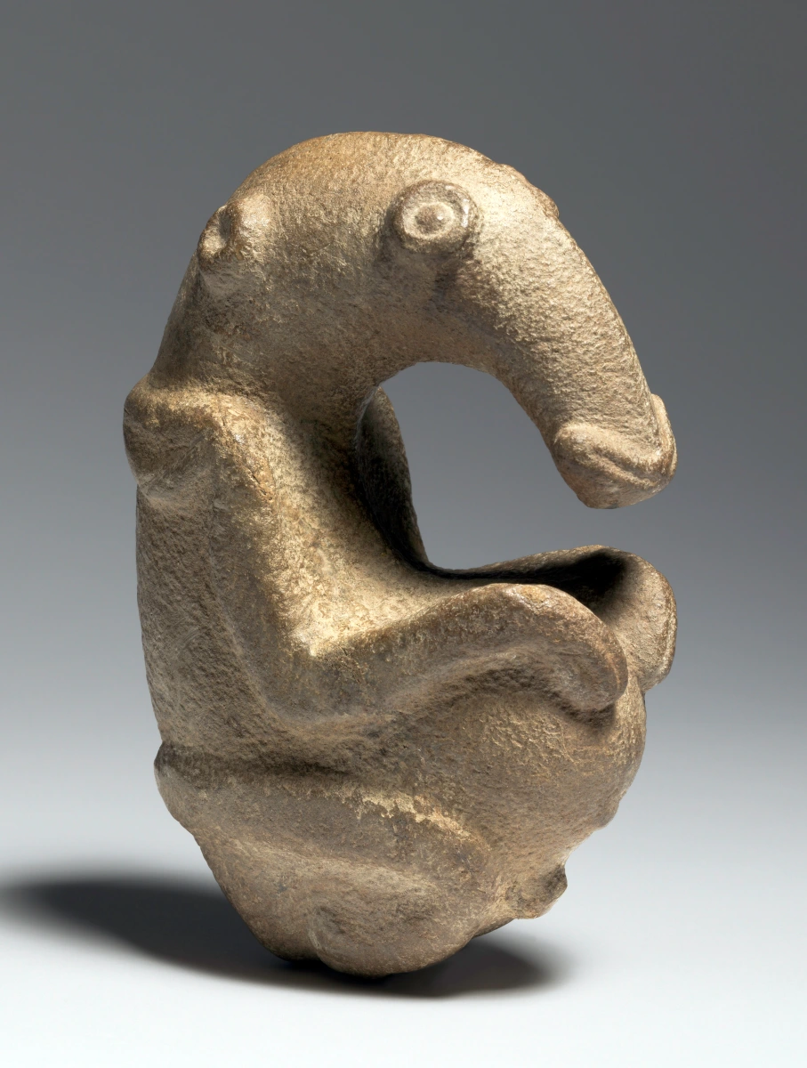 <p>Artifact discovered in Papua New Guinea, believed to be from 1500 BCE. Made of greywacke stone and depicts a human-like figure with a bird's head. Significance is unknown.</p>