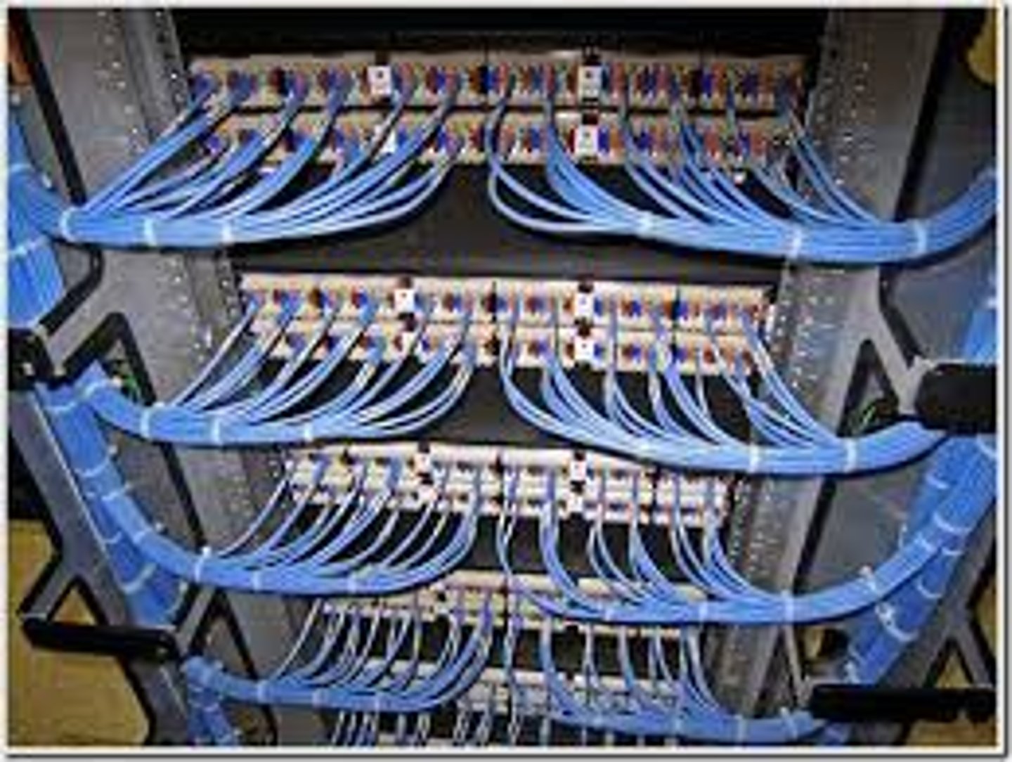 <p>A wall-mounted panel of data receptors into which cross-connect patch cables from the punch-down block are inserted.</p>