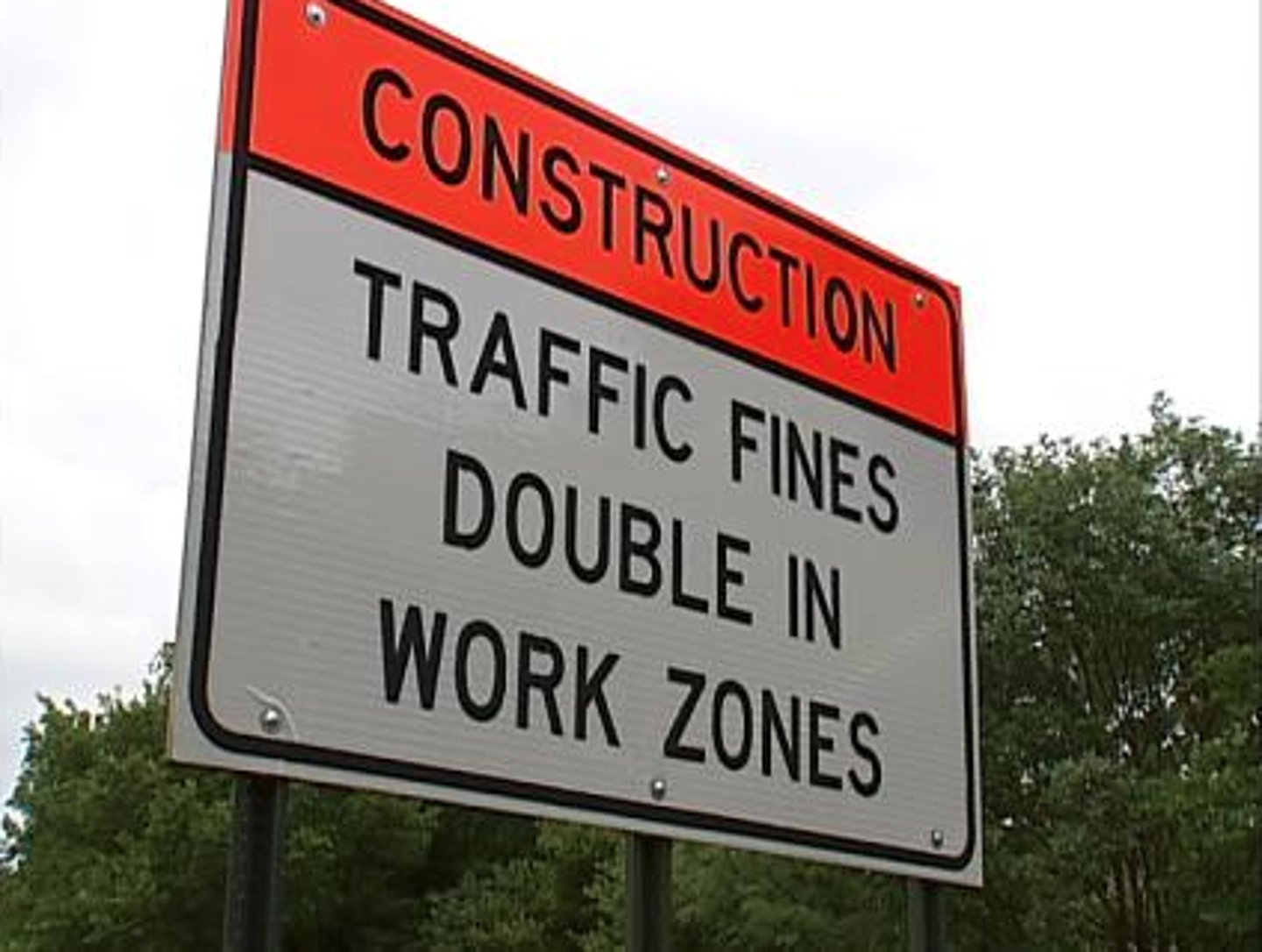 <p>Could also be diamond shaped orange sign with black letters stating "Fines Double in Work Zones When Workers are Present"</p>