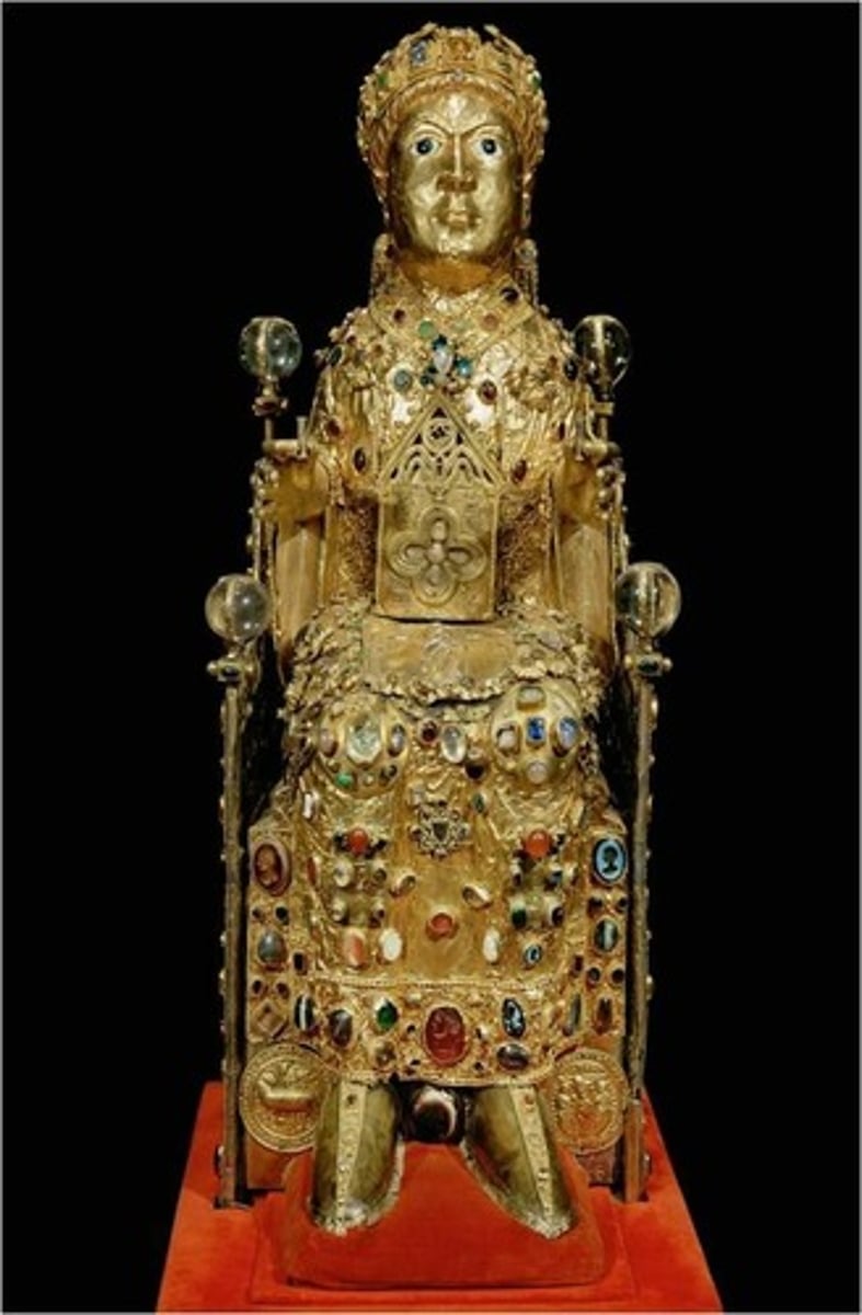 <p>9th century AD; stone (architecture); stone and paint (tympanum); gold, silver, gemstones and enamel over wood (reliquary)</p><p>- brought wealth and attracted tourists to the church</p><p>- The girl who died a martyr (for believing in Christianity in a time during the Roman empire where only pagan gods should be worshipped)</p><p>She was 13-14 years old when she died and the reliquary holds her skull inside</p><p>Much more simplistic early on → got bedazzled later on</p>