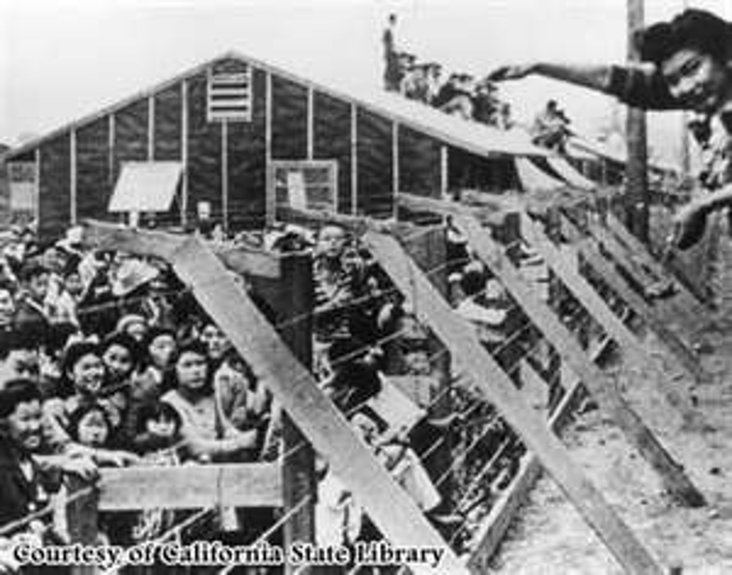 <p>The forcible relocation of approximately 110,000 Japanese Americans to housing facilities called "War Relocation Camps", in the wake of Imperial Japan's attack on Pearl Harbor.</p><p>La reubicación forzosa de aproximadamente 110.000 estadounidenses de origen japonés a instalaciones de alojamiento llamadas "Campos de Reubicación de Guerra", tras el ataque del Japón imperial a Pearl Harbor.</p>