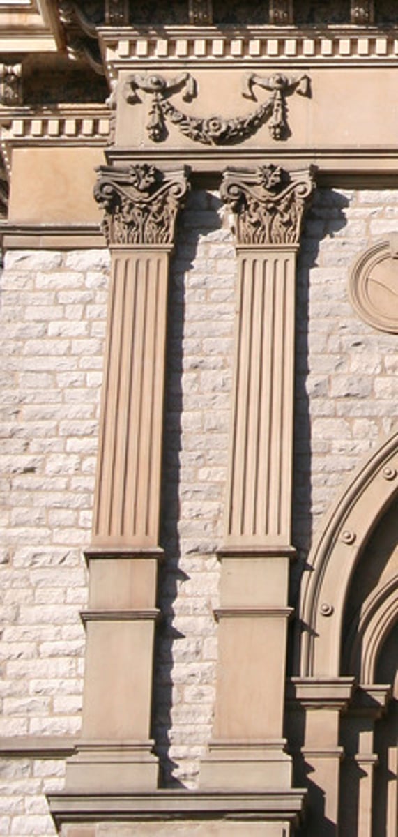 <p>a rounded column attached to the wall / a square column attached to the wall</p>