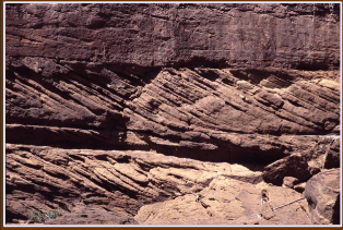 <p>Any layering in sedimentary rock that is oriented at an angle to the horizontal deposition. Often caused by dune migration; ripples produce cross-lamination</p>
