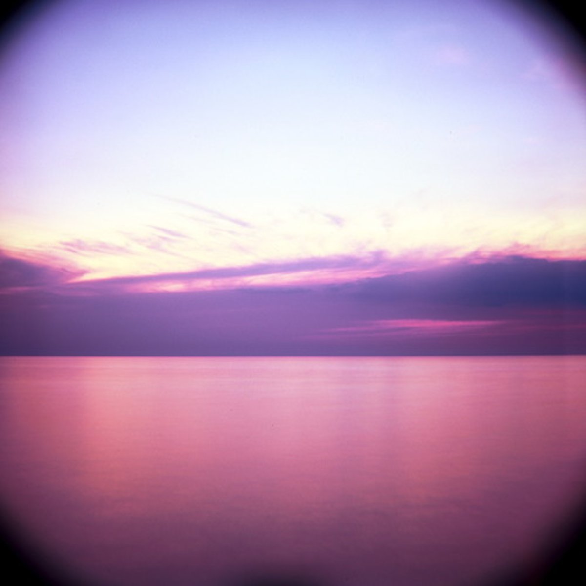 <p>a lens with a longer focal length than standard, giving a narrow field of view and a magnified image</p>