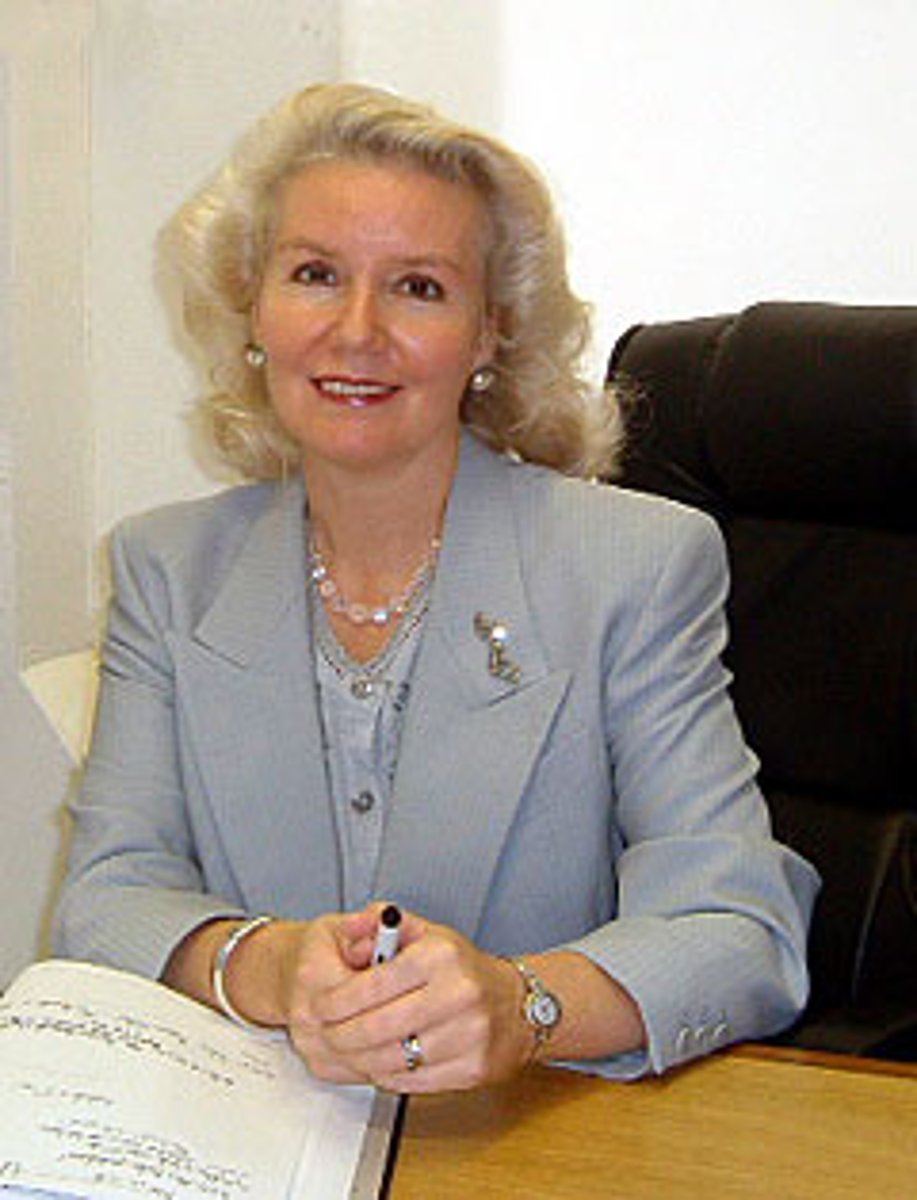 <p>a woman in charge of a private school</p>