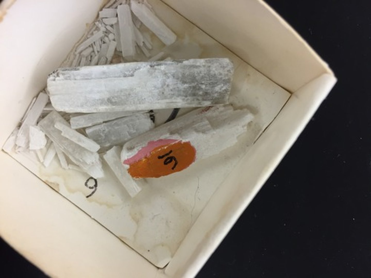 <p>Monoclinic.<br>Coarse, long, splintery, cleavable aggregates. <br>H = 3<br>SG = 1.95<br>Vitreous to pearly luster.<br>Color = colorless to white.<br>Colorless varieties become chalky white on long exposure to air because of tincalconite. <br>Slowly soluble in water. <br>Formed by recrystallization of borax.<br>Locality in Mojave Desert.</p>