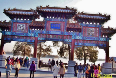 <p>Wooden pillars on stone bases. Pillars painted red, beams decorated with intricate designs and Chinese calligraphy, and the roof covered with colored tiles, complete with mythical beasts just like a Chinese palace.</p>