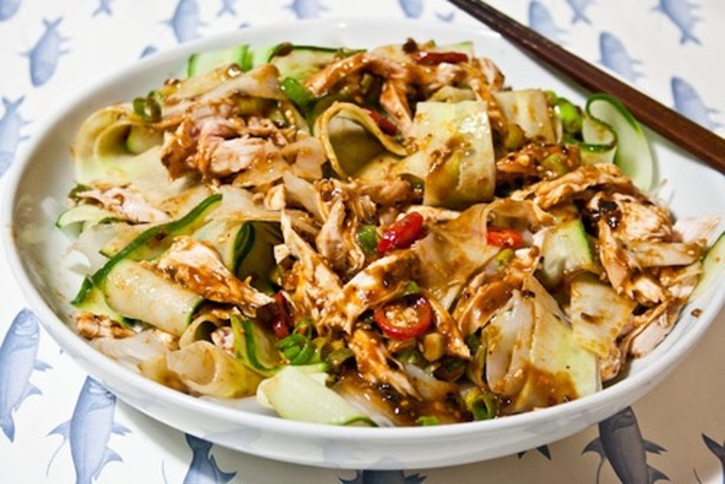 <p>cold and covered in sauce (liángbàn)</p>