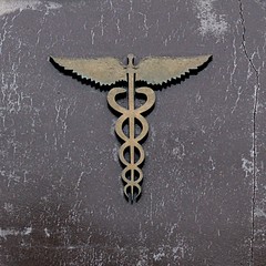 Wand with snakes twined around it, often held by Hermes