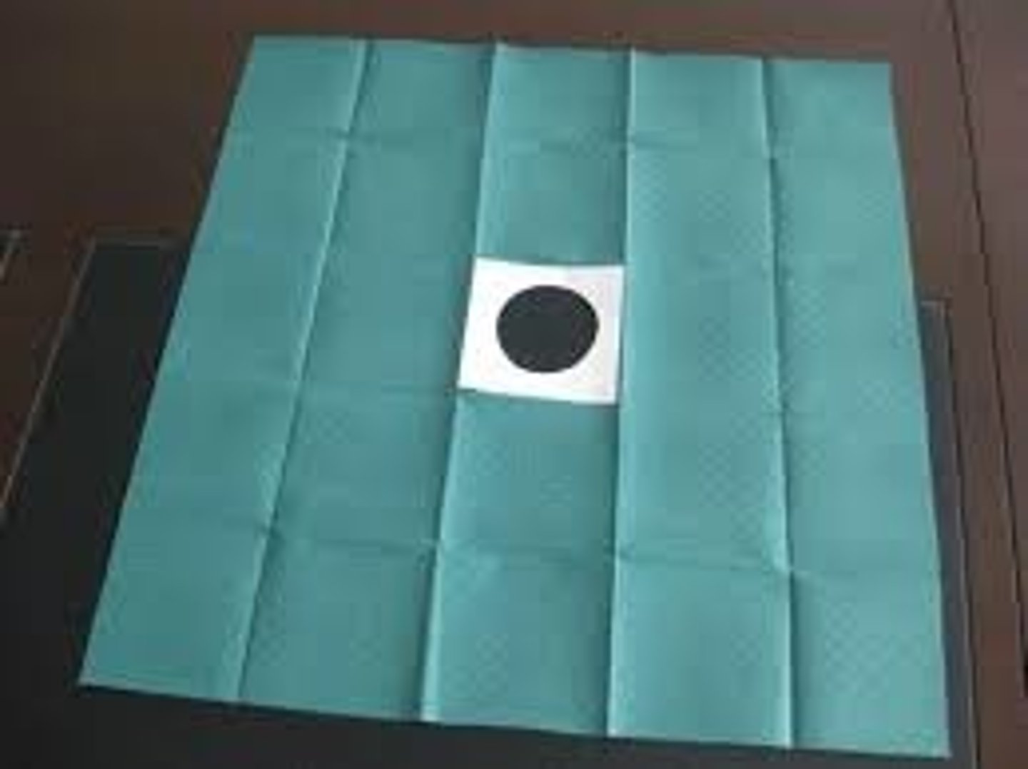 <p>Drape with an opening for catheter insertion.</p>