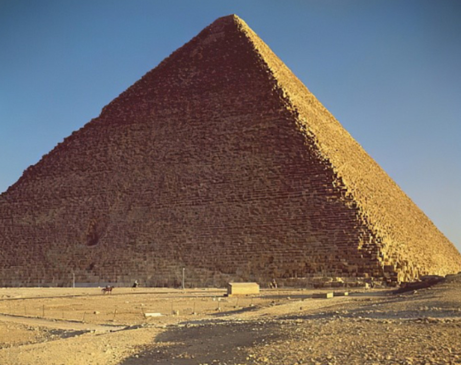 <ul><li><p>At Giza, Egypt</p></li><li><p>Made out of (cut) Limestone</p></li><li><p>ca. 2550 BCE (Old Kingdom)</p></li><li><p>Largest of the great pyramids. Part of a complex that included a temple and small pyramids. Multiple chambers held within. The shape references the sun’s rays which act as a ramp for the pharaoh to climb to the sky to get to afterlife. Was the link between gods (the divine) and pharaohs.</p></li></ul>
