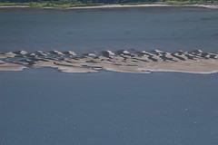 <p>A ridge of sand and shingle which has joined two headlands, cutting off a bay</p>