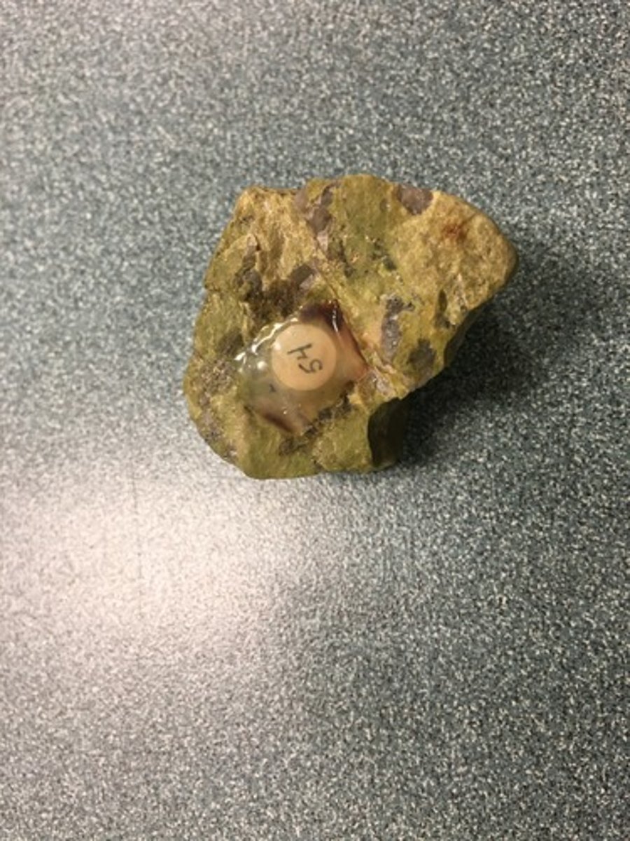 <p>greenish, one good cleavage, earthy, hardness&gt;6.5</p>