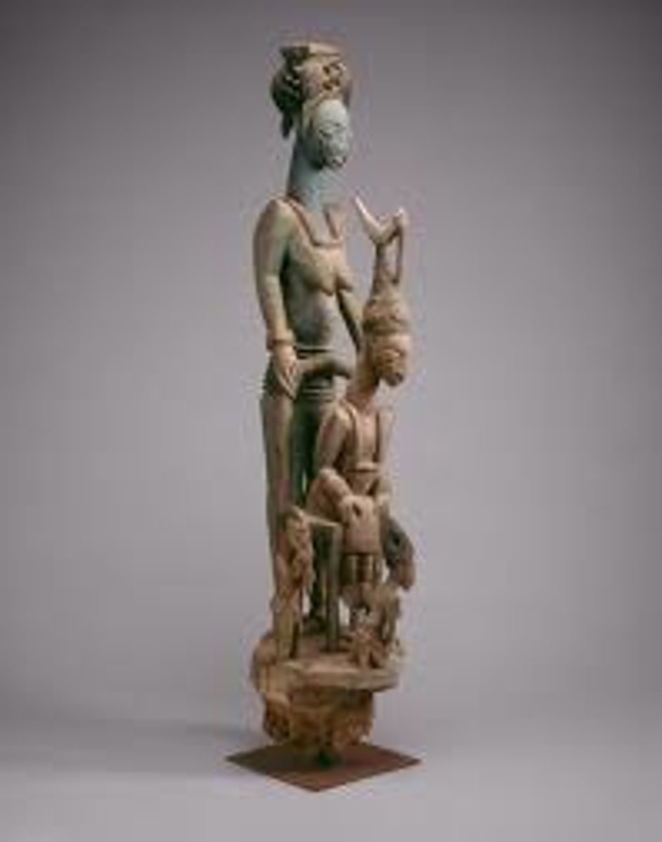 <p>Olowe of Ise (Yoruba peoples)</p><p>c. 1910-1914 CE</p><p>Form: Wood and pigment</p><p>Function: Served as the support for the verandas of a inner place in Nigeria</p><p>The post is one of four of its kind, all utilizing sculptural groups or sculpture including more than one subject. In this example, hierarchy of scale is used to show the importance of women in society. The King's senior wife stands tall above the King himself. She is there to crown him during his coronation and to help protect him during his reign. At the bottom of the post, smaller figures are represented to show the junior wife and other members of the court kneeling to honor the King.</p>