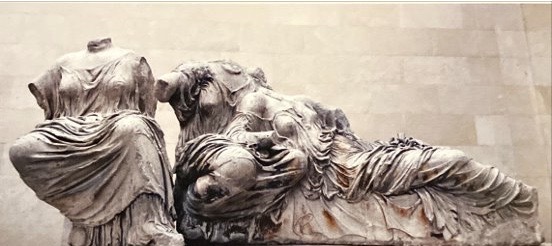 * The East pediment shows the birth of Athena who is the patriot god of Athens ​
* According to the myth Athena was born fully grown and fully armed for the head of her father Zeus 

\
Three Goddesses on the right:

* The three goddesses on the right are likewise shown to be at ease resting on the lap on another showing great intimacy and familiarity ​
* These mirrored reclining figures contrast both in their use of drapery and in their interaction with other figures​
* The figures are not looking at the events at the centre of the pediment however, perhaps suggesting that the news of Athena’s birth has not yet reached them ​
* It is possible that the sculptors did not know how to fill the awkward triangular shape to bring the narrative together 