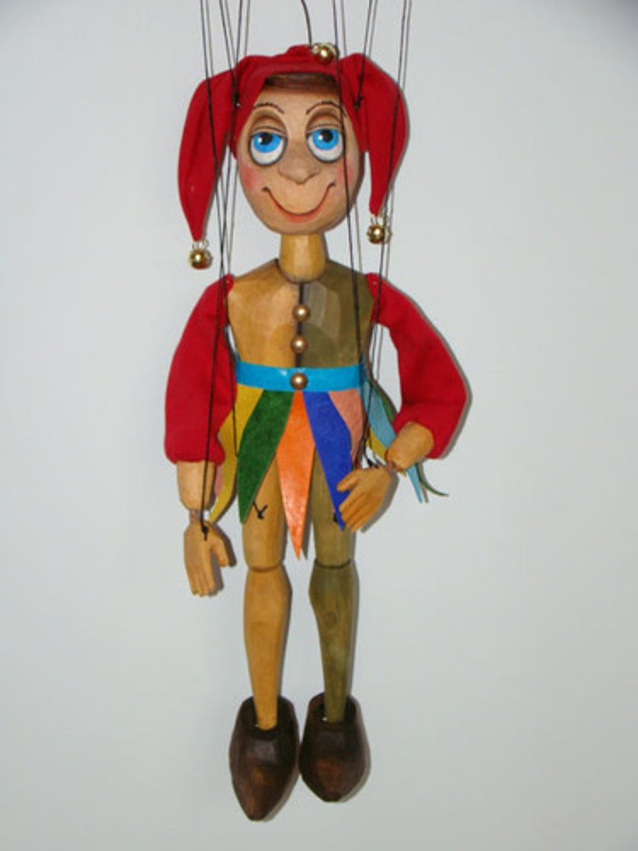 <p>a toy in the shape of a person or animal that you can move with strings or by putting your hand inside; a person or group whose actions are controlled by someone else (марионетка, кукла)<br><br>The children were spellbound by the _________ show.<br>Дети были очарованы кукольным спектаклем.<br><br>Our mayor is a _________ to a corrupt and powerful camarilla.<br>Наш мэр — марионетка в руках могучей коррумпированной клики.</p>