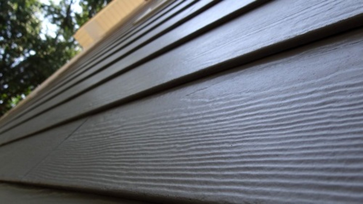 <p>composite building material made from cement, sand, water, and cellulose fibers, used primarily for exterior siding and cladding.</p>
