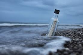 <p>a bottle with a message inside that is set adrift to be found by someone else.</p>