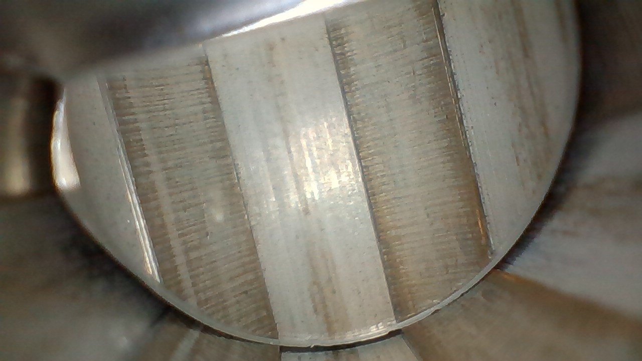 <p>What type of machining likely left these perpendicular markings in the grooves of this barrel?</p>