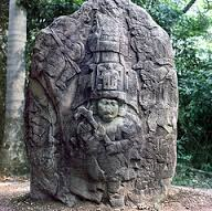 depict rulers in elaborate ritual garb, often surrounded by "flying" figures