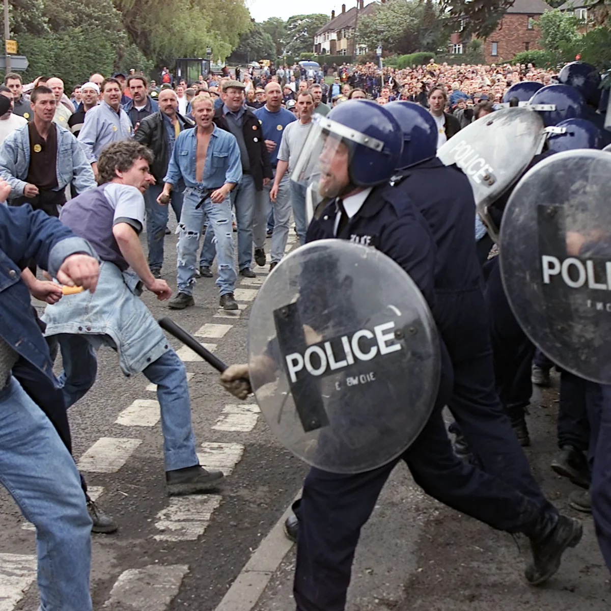<p>Title: Reenactment of the Battle of Orgreave</p><p>Time: 2001</p><p>Known for:</p><ul><li><p class=""><em>The Battle of Orgreave</em> is a <strong>large-scale reenactment </strong>of a <strong>violent clash between striking miners and police</strong> that originally took place in 1984 during the UK miners’ strike, involving over 800 participants, many of them actual miners and local residents.</p></li><li><p class="">It investigates the <strong>politics of memory</strong>, <strong>class struggle</strong>, and <strong>collective trauma</strong>, using historical reenactment as a form of social commentary.<strong> </strong></p></li><li><p class=""><strong>Blurs the line between documentary, performance, and activism.</strong></p></li></ul><p></p>