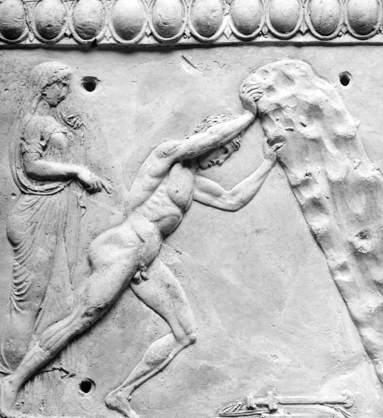 <p>Who is the man lifting the rock?</p>