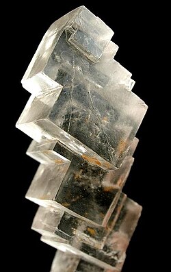 <p>Cleavage where the mineral breaks in three directions (also identify mineral)</p>
