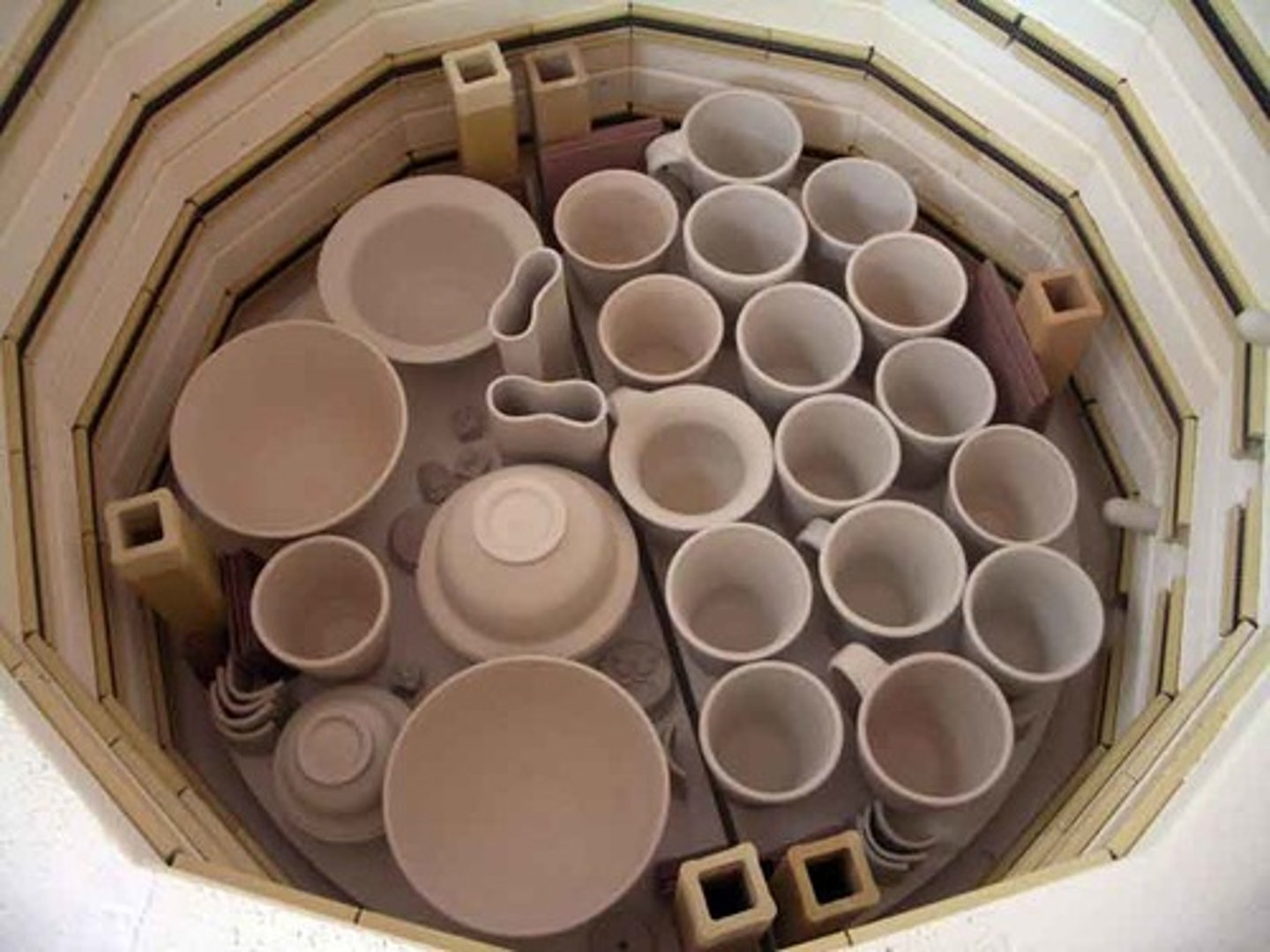<p>unglazed ceramic ware that has been fired at a low temperature to remove all moisture from the clay body and to make handling easier during glazing; the first firing; turns clay to stone</p>