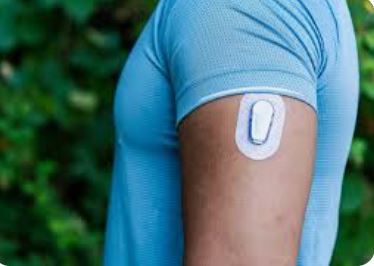<p>Continuous Glucose Monitor </p><ul><li><p>patch on arm that has a needle pricking their skin ( constant catheter) </p></li><li><p>monitors your blood sugar, and sends it to your phone if blood sugar is dangerously low.</p></li></ul><p></p>