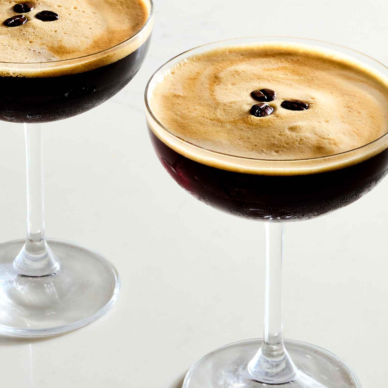 <p>coffee/cream, 1 oz vodka or reposado, 1 oz coffee liqueur, 1 oz espresso, 0.25 oz simple syrup, served straight up, garnished with 3 coffee beans</p>