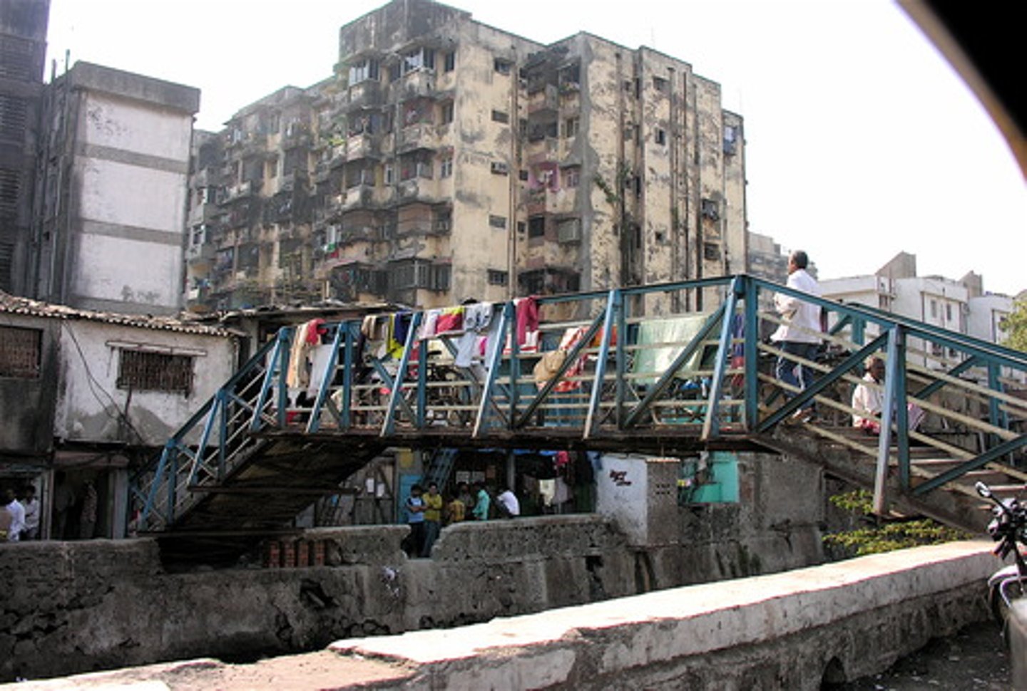 <p>The poorest, most marginalized areas within cities, often located on the periphery or near hazardous industrial sites.</p><p>-Characterized by extreme poverty, high crime, lack of, or disconnection from, infrastructure and city services. Frequently feature informal housing, slum settlements, or, in the Latin American city model, favelas.</p>