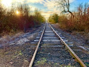 <ul><li><p>Parallel lines appear to converge at a distance.</p></li><li><p>We know that the tracks at right are parallel. As the rails appear to move closer together, we perceive them as being farther away.</p></li></ul><p></p>