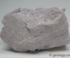 <p>igneous, dominant minerals are orthoclase, quartz, plagioclase, biotite, and hornblende. fine-grained texture, light color, crystals not visible.</p>