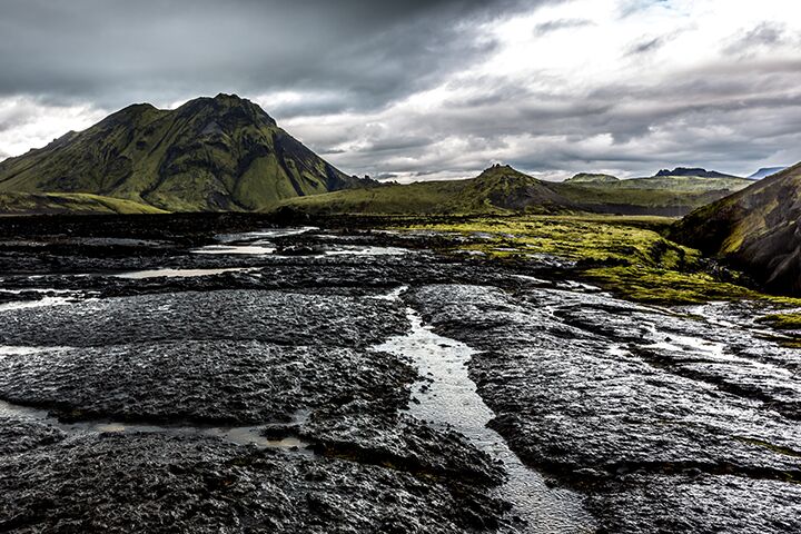 <p>The breakdown of rocks into small grains or soil</p><p>Rocks at the surface are weathered by wind, flowing water, heat and other processes.</p>