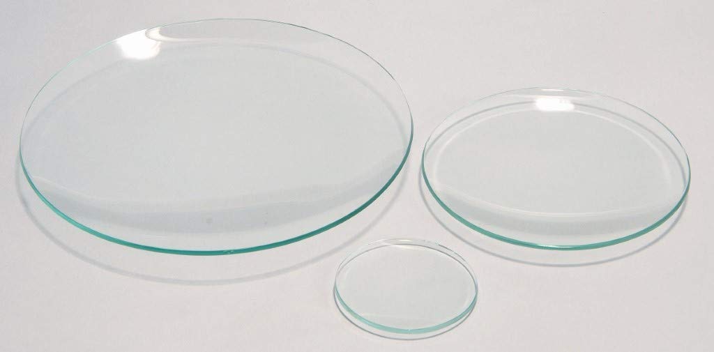 <p>A chemistry watch glass is a circular, concave-shaped piece of glassware commonly used in laboratories. It is typically made of borosilicate glass and has a flat bottom and a slight curvature on the top surface. The watch glass is used for a variety of purposes, such as holding small amounts of solid or liquid substances, covering beakers or evaporating dishes to prevent contamination or evaporation, and facilitating the evaporation of small volumes of liquids. It is called a &quot;watch glass&quot; because it resembles the glass cover of a pocket watch.</p>