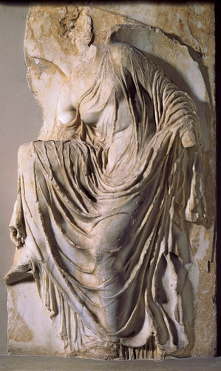 <p>Period: Early Classical 5th Century B.C.E.</p><p>Form: Marble</p><p>Function: Decorative</p><p>Content: Athena is shown adjusting her sandal. Humanized. Temple of Athena. Nearly transparent garments. Folds form intricate linear patterns. Less ideal. Marks transition into Late Classical.</p>