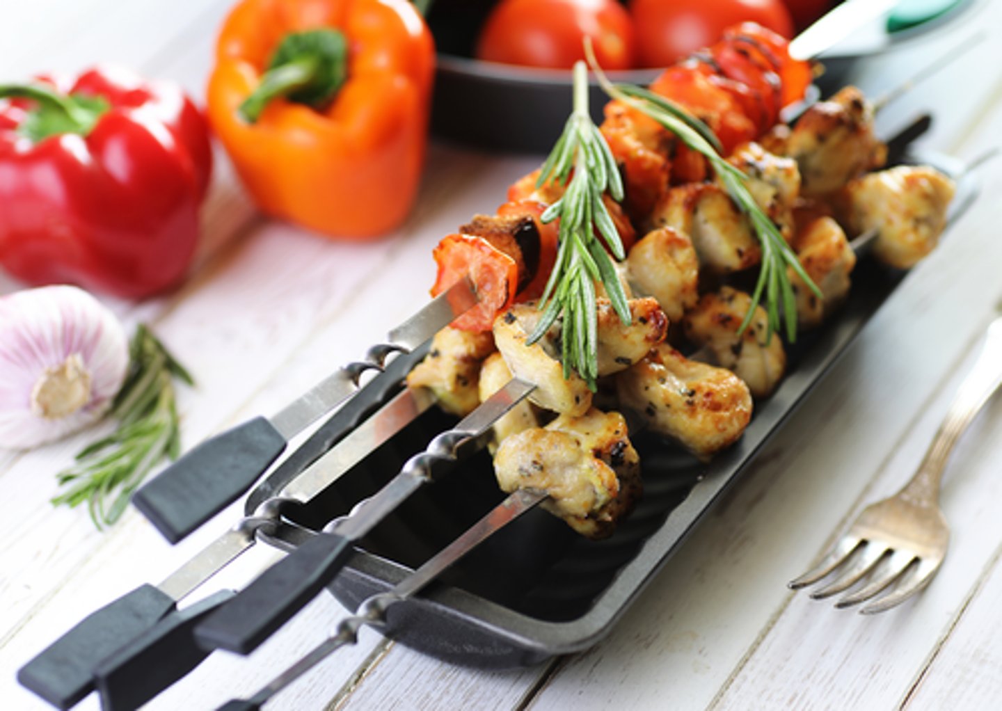 <p>a thin stick of wood or metal used to hold small pieces of food together while cooking.</p><p>We each had one _________ with chicken and one with grilled vegetables.</p>