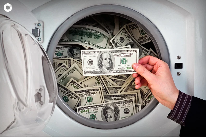 <p>earning illegal money from what appears to be a legal source</p>