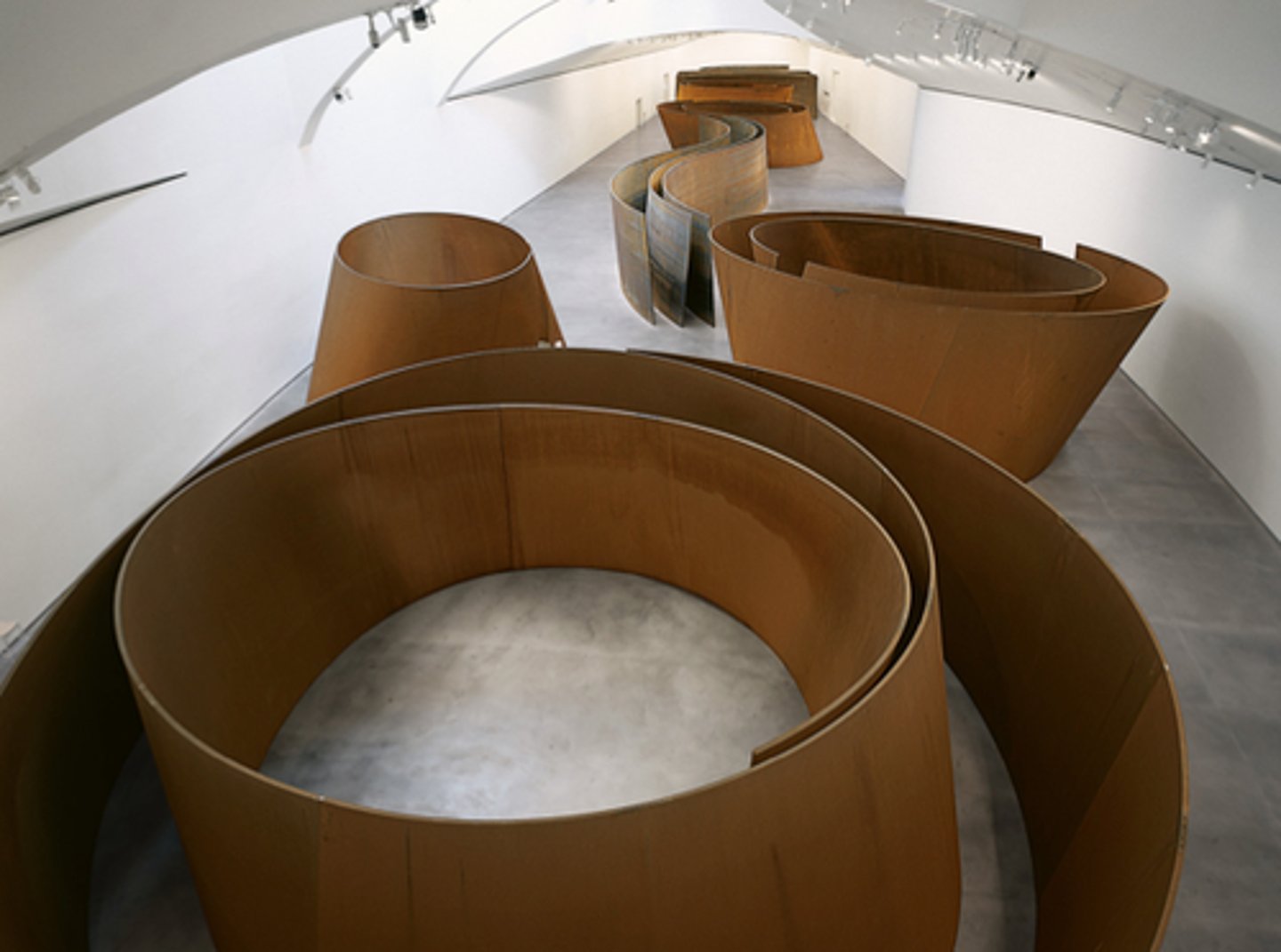 <p>-Renowned for his large-scale, site-specific sculptures made from industrial materials like steel.</p><p>-His work often explores the relationship between form, space, and viewer experience, with an emphasis on physicality and environmental integration.</p>