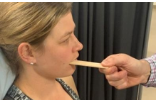 <p>Bite down on the spatula</p><ul><li><p>pain ipsilateral = due to capsular stretch/distraction </p></li><li><p>pain contralateral = due to joint loading/compression</p></li></ul><p></p>