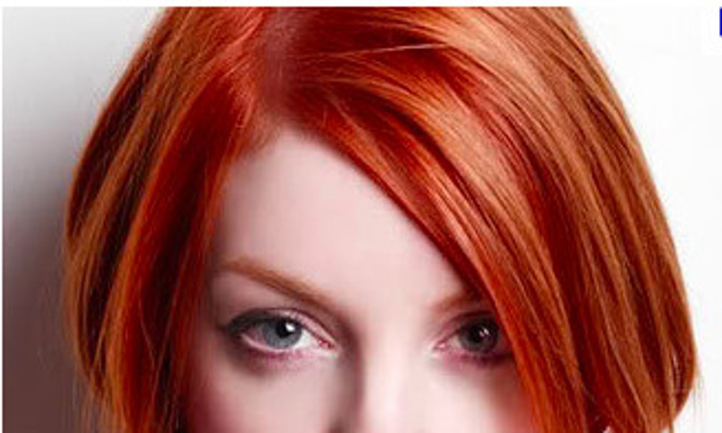 <p>red-haired/red-headed</p>
