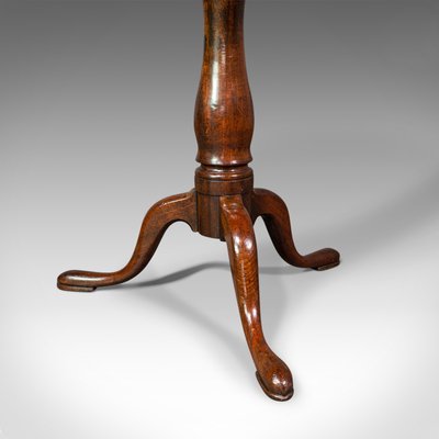 <p>Characterized by a carved, S-shaped curve that resembles the coiled body of a snake</p>