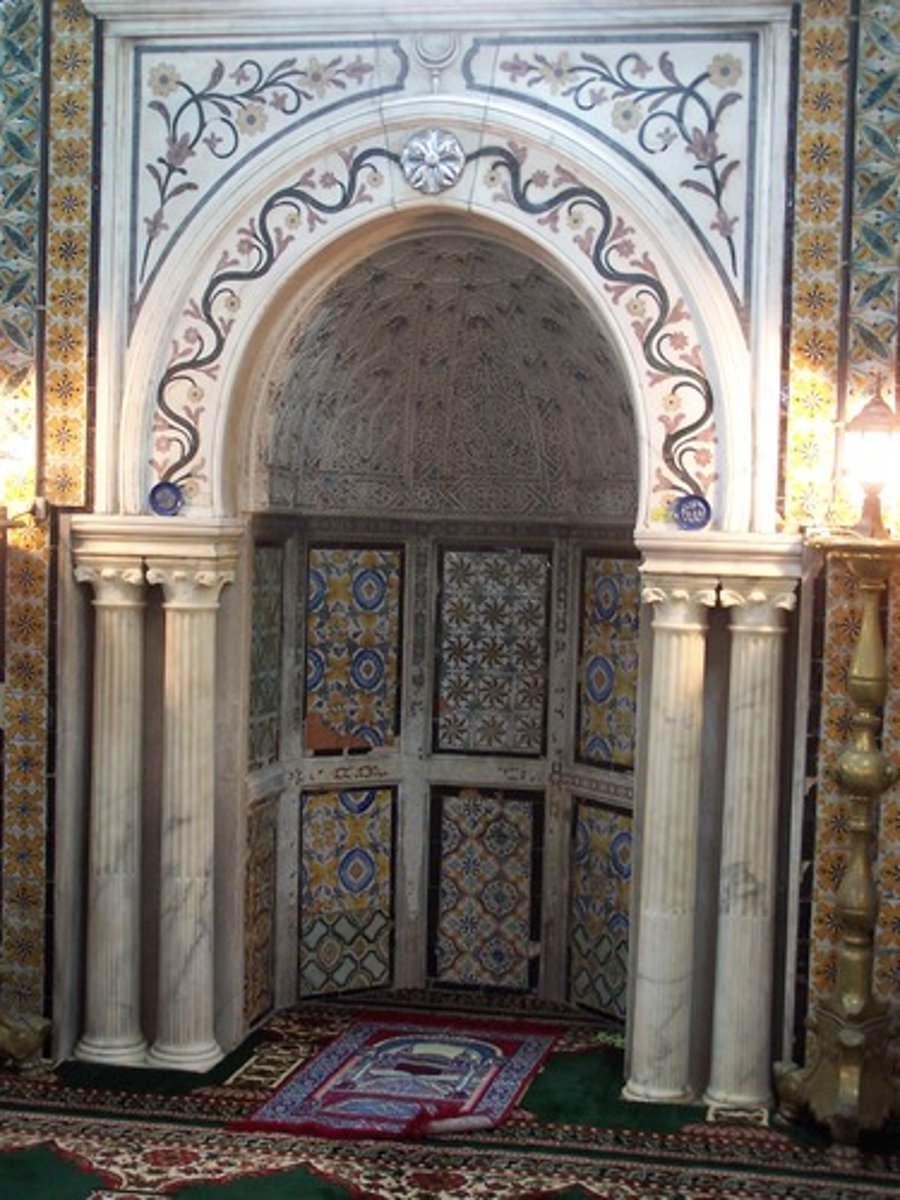 <p>A semicircular niche set into the qibla wall of a mosque that marks the direction of Mecca.</p>