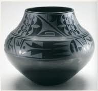 <p><strong>Definition:</strong> The Black-on-Black ceramic vessel, crafted by renowned Puebloan artists Maria and Julian Martinez, is a notable example of Native American pottery that showcases traditional techniques and artistic innovation. This vessel is characterized by its distinctive black-on-black design, achieved using a slip rubbed onto the surface before firing, creating a matte finish against a shiny black background. Maria Martinez, a master potter, was instrumental in reviving and popularizing this style, which reflects the Puebloan culture and its connection to the land. The craftsmanship involved meticulous hand-coiling and decoration, often inspired by traditional Pueblo patterns and symbols, making each piece unique. Today, these vessels are celebrated not just as functional objects but also as important cultural artifacts representing the heritage and artistry of the Pueblo people.</p>