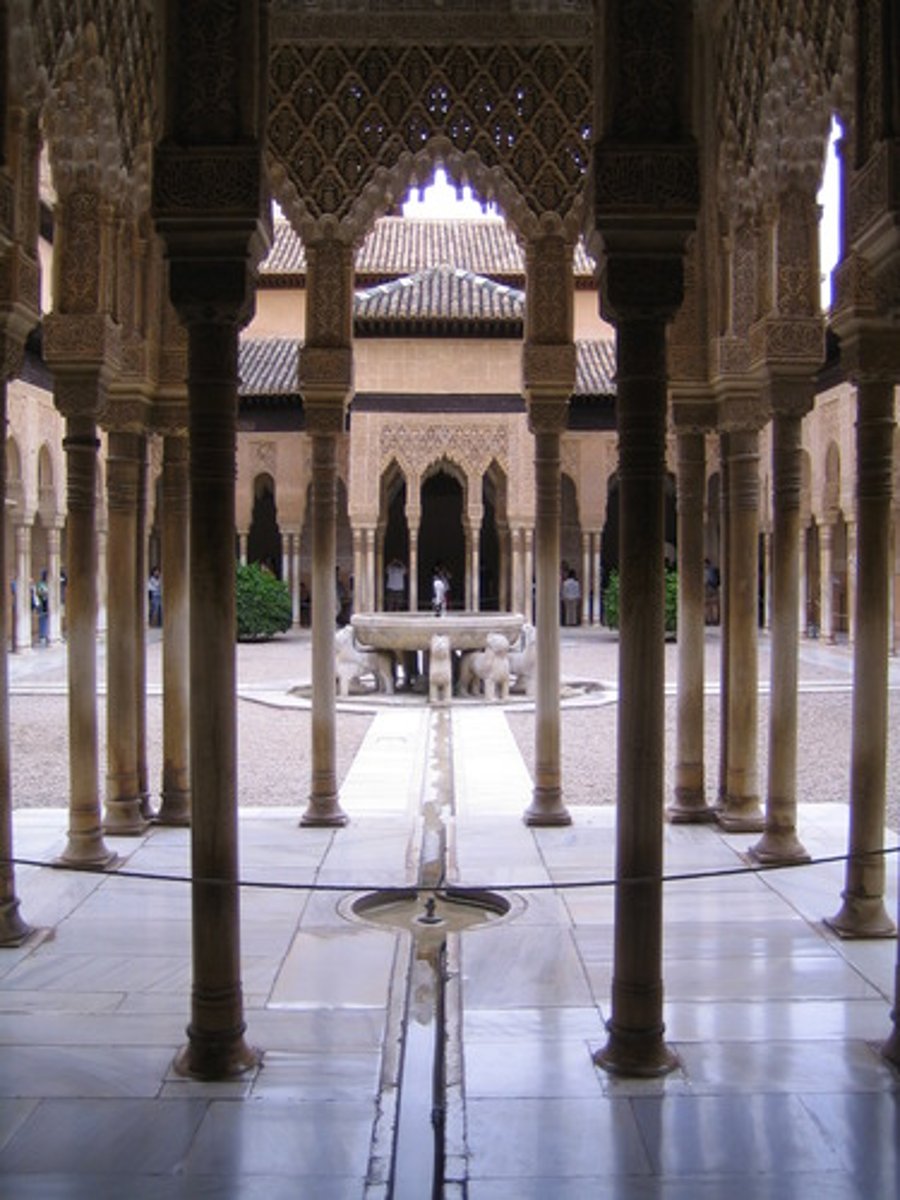 <p>The Court of Lions has adjoining side rooms and upper galleries, becoming the most innermost and private courtyard under the Islamic rule. Four streams under the fountain broke the courtyard into four equal segments with two small fountains at each patio. Water features evoke images of oasis pools. Features muqarna (honeycomb) ceiling.</p>